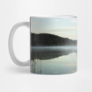 Misty Lake light blue. Amazing shot of the Ferchensee lake in Bavaria, Germany. Scenic foggy morning scenery at sunrise. Mug